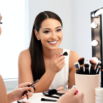 **Image Prompt:** A confident beauty consultant smiling, applying makeup on a client in a well-lit studio. Focus on creating a positive and empowering atmosphere. Soft, natural lighting. Makeup brushes and various beauty products on a nearby table. Background should subtly hint at a modern, minimalist studio space.